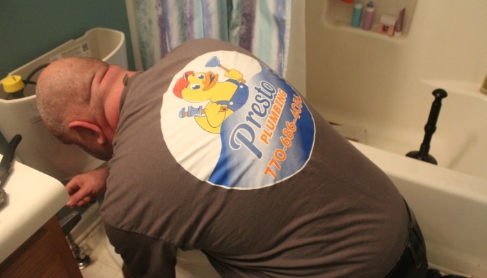 Plumber Installing Toilet